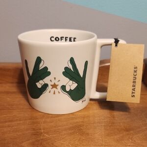 Starbucks White Mug with Green Hand Design